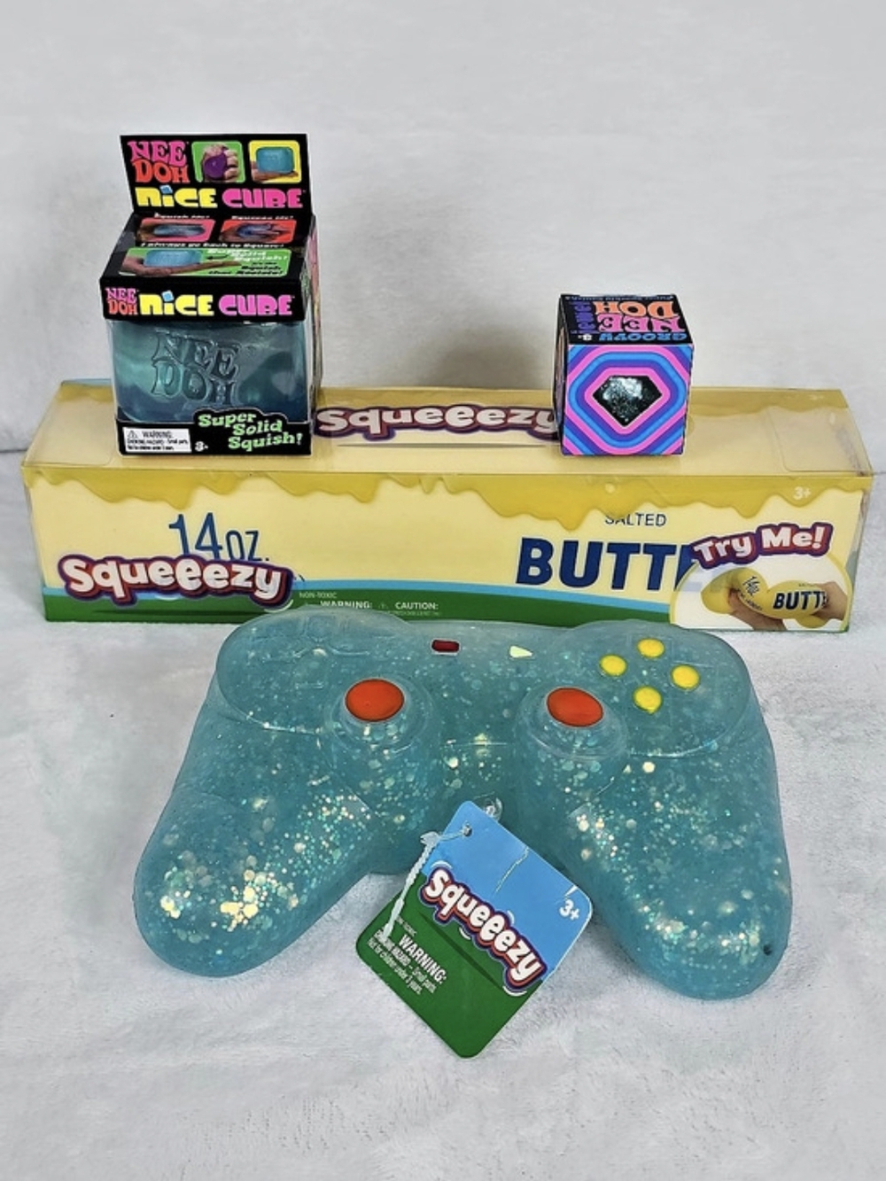 Nee Doh Squeeezy Squishy Bundle Of 4 Butter Nice Cube Remote Controller Jewel